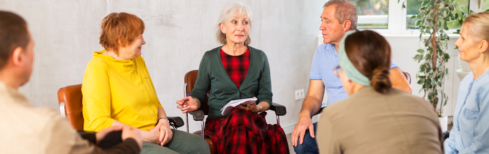 Image of medicare provided counselor with senior couple as patients.